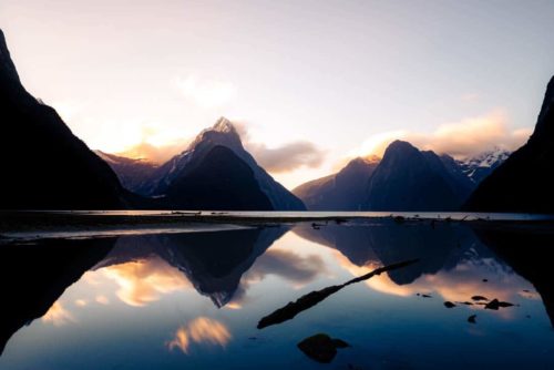 Milford Sound Piopiotahi fiord fiordland nz nouvelle zélande new zealand mountain tasman sea mitre peak water reflect reflet sunset coucher de soleil blue Symétrie nature calm relax